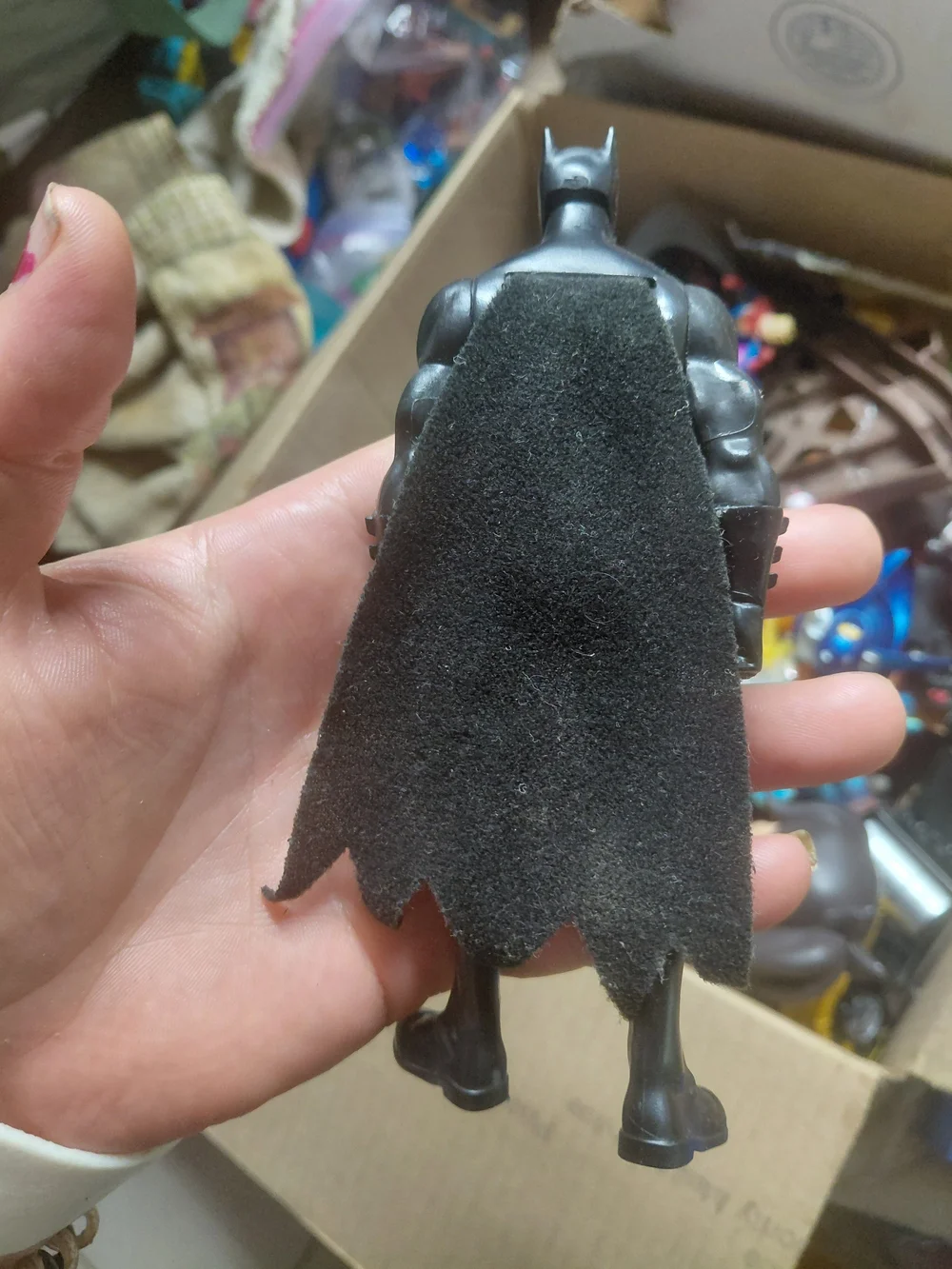 6-inch Mattel Justice League Batman action figure, recognized by its bright yell